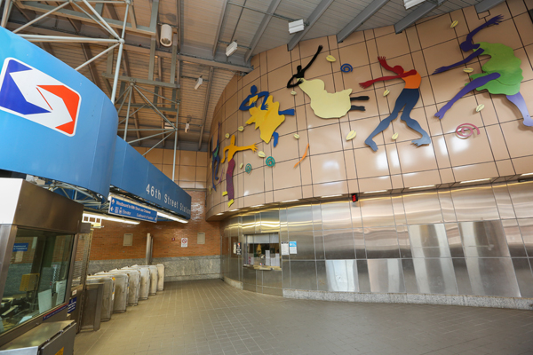 Barbara Bullock's colorful stainless steel dancers along the wall at 46th Street SEPTA Station