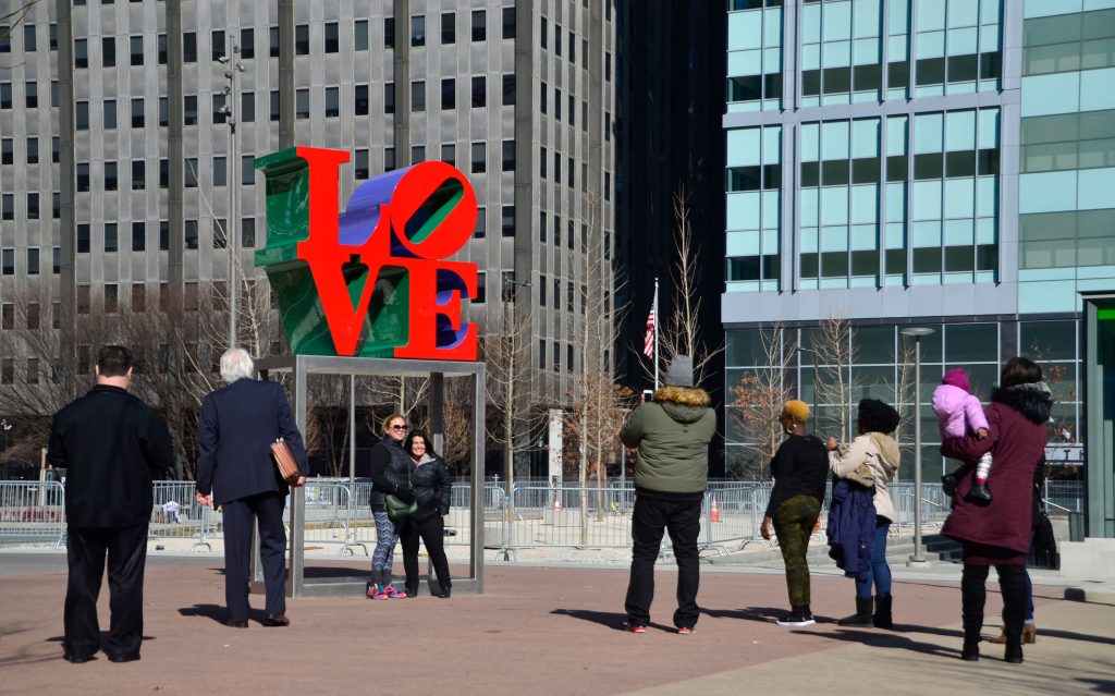 People taking photos with the LOVE sculpture